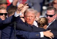 Donald Trump Raised Fist Bloodied Trump With Raised Fist: An Image Likely To Fuel Campaign