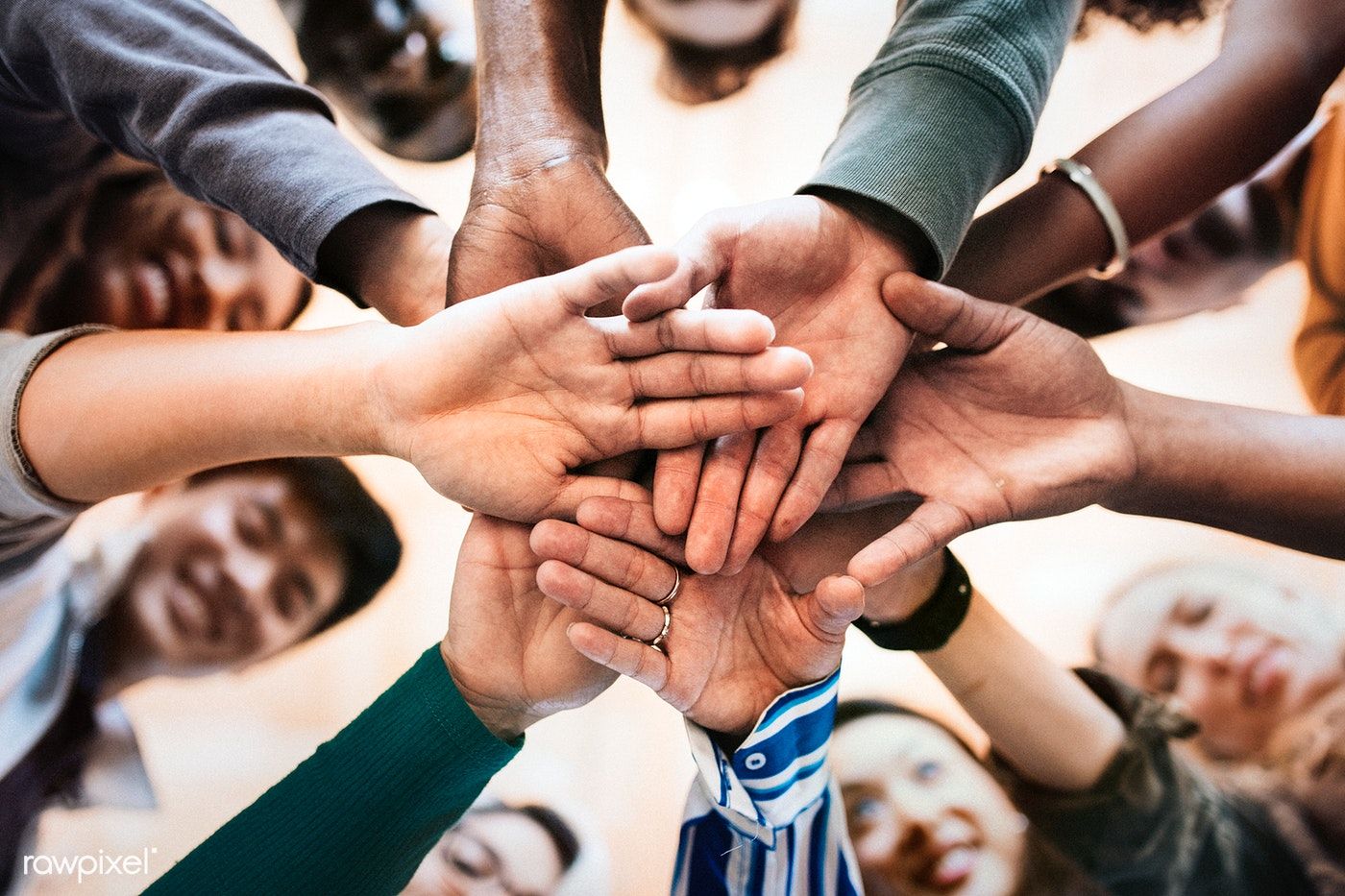 Iplayer Icon.png – Group of diverse people stacking hands in the middle