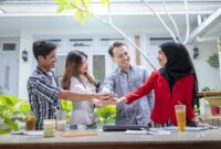 Dr Who Unmade Episodes – Indonesian business office teamwork for a startup company, smiling for …