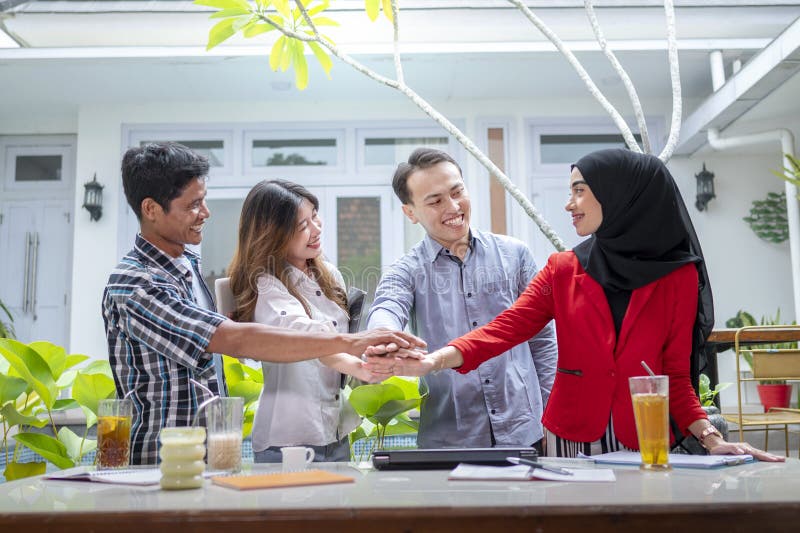 Dr Who Unmade Episodes – Indonesian business office teamwork for a startup company, smiling for …