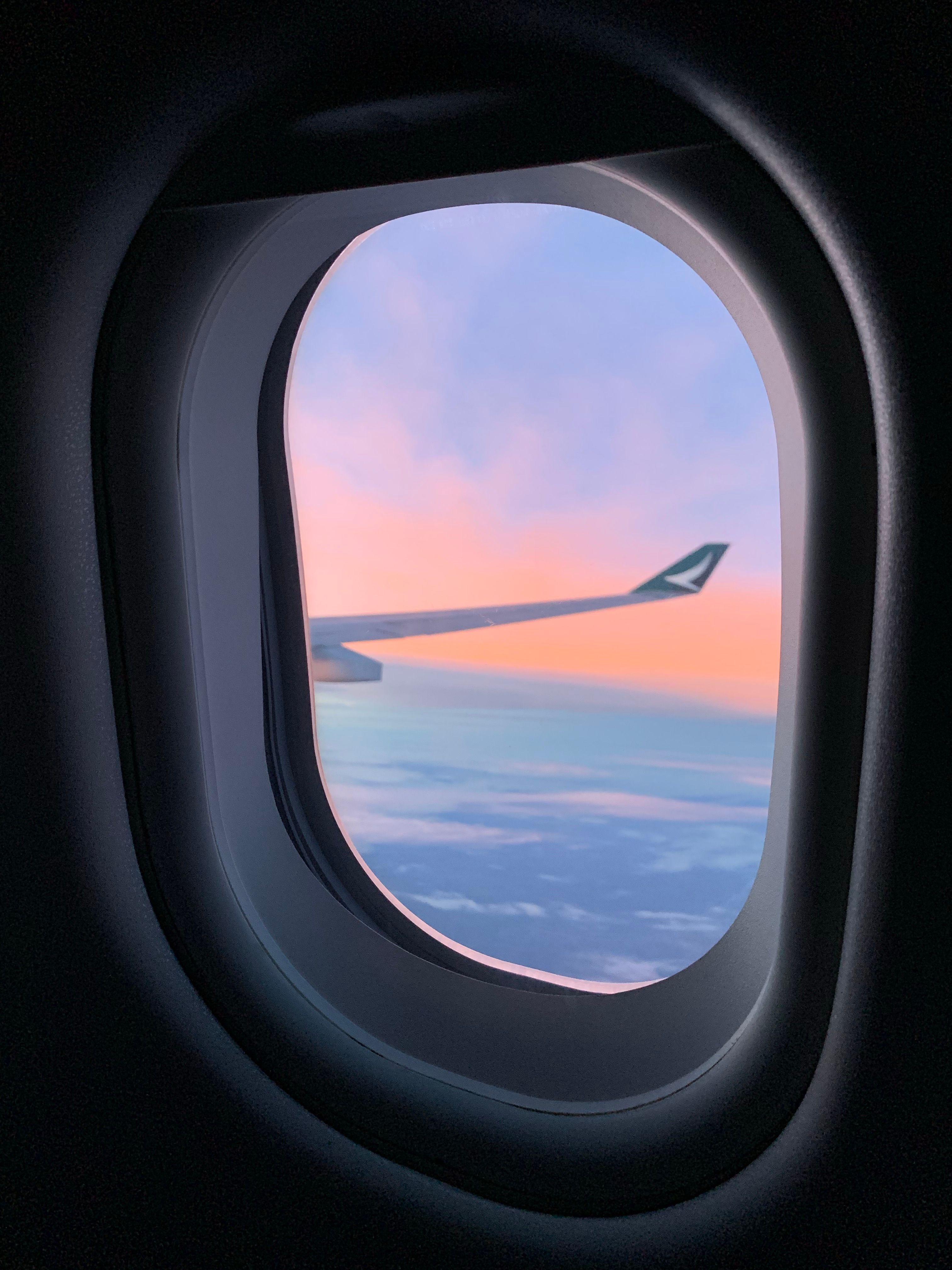  View Of The Clouds And Airplane Wing From The Aircraft Window · Free Motiv 