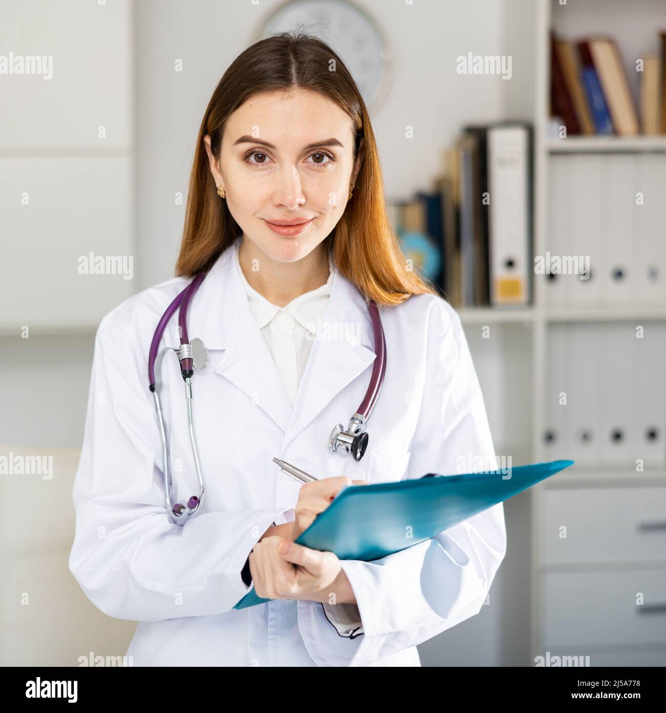 Female medical worker standing hi-res stock photography and images - Alamy