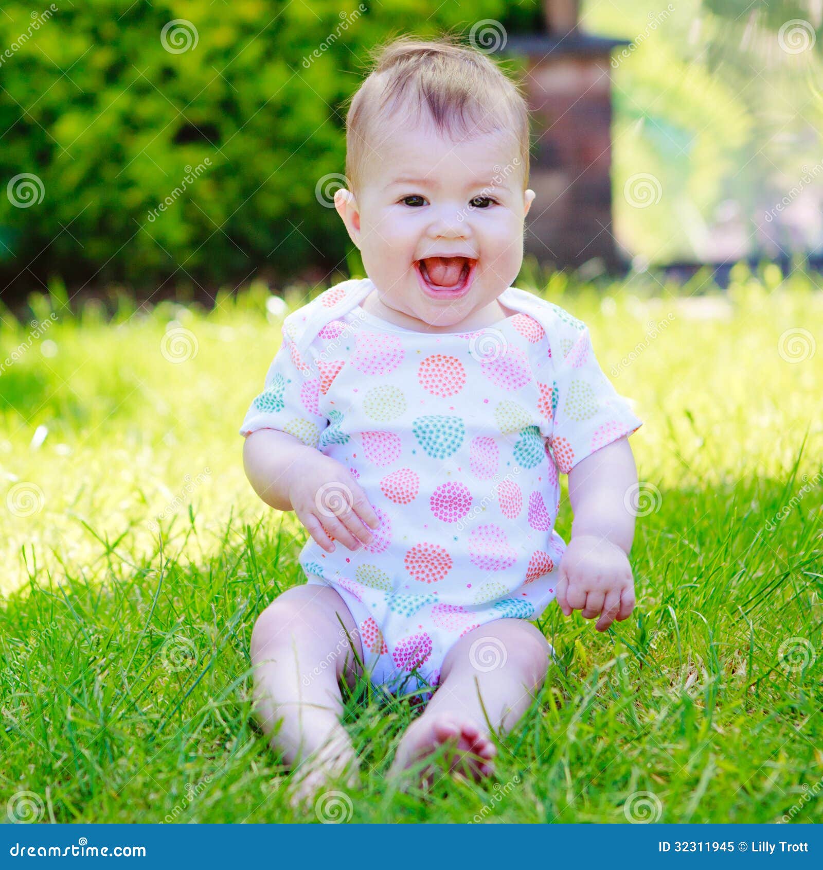  Foto zu A Laughing Baby in a Vest Sitting on the Grass Stock Image - Image of 